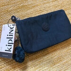 Kipling Navy Pouch with Furry Charm